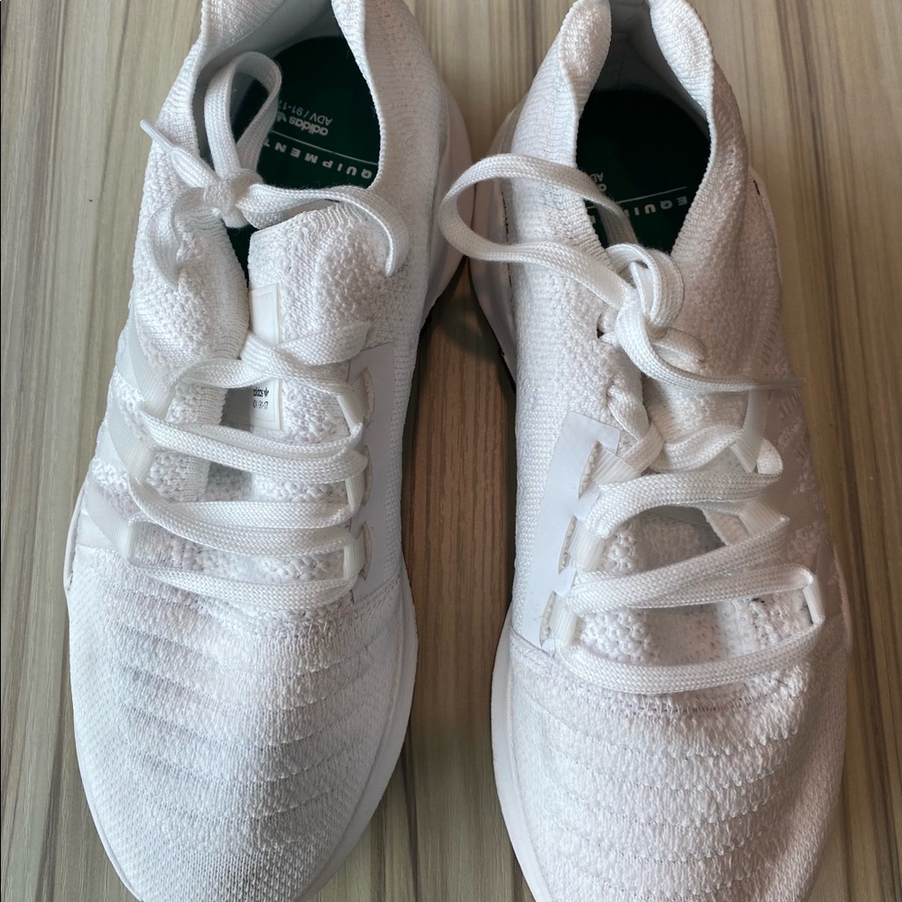 !White Adidas sneakers.